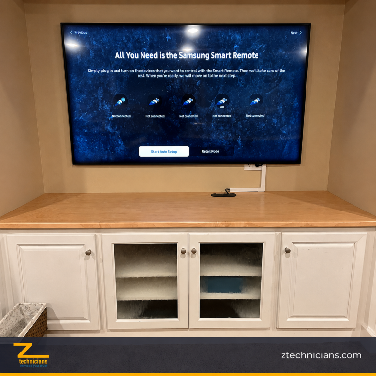 Samsung TV wall installation with cable cover above built-in cabinets