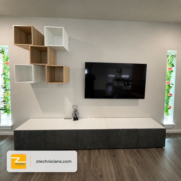 TV wall mounting beside custom floating shelves and media cabinets